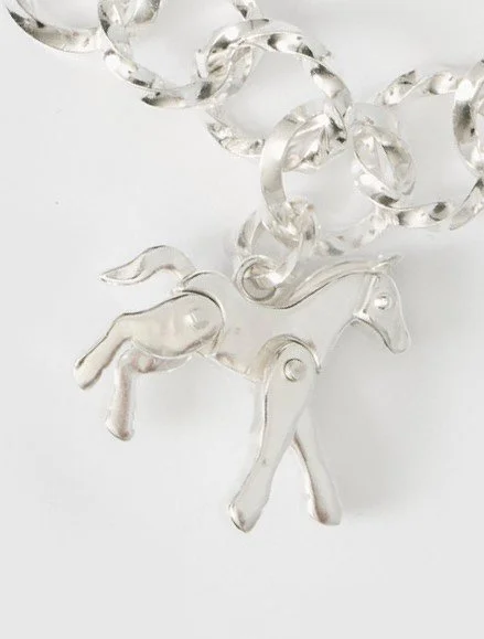Silver horse charm detail